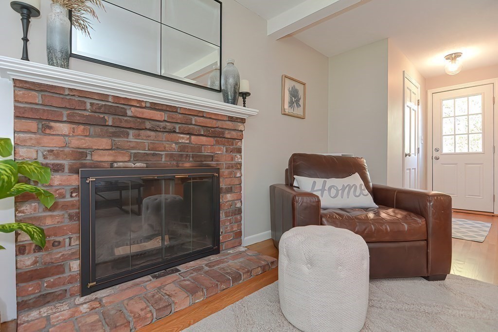 2 Meadowbrook Road Acton, MA 01720 - Photo 16 of 36 a living room with furniture a fireplace and a window