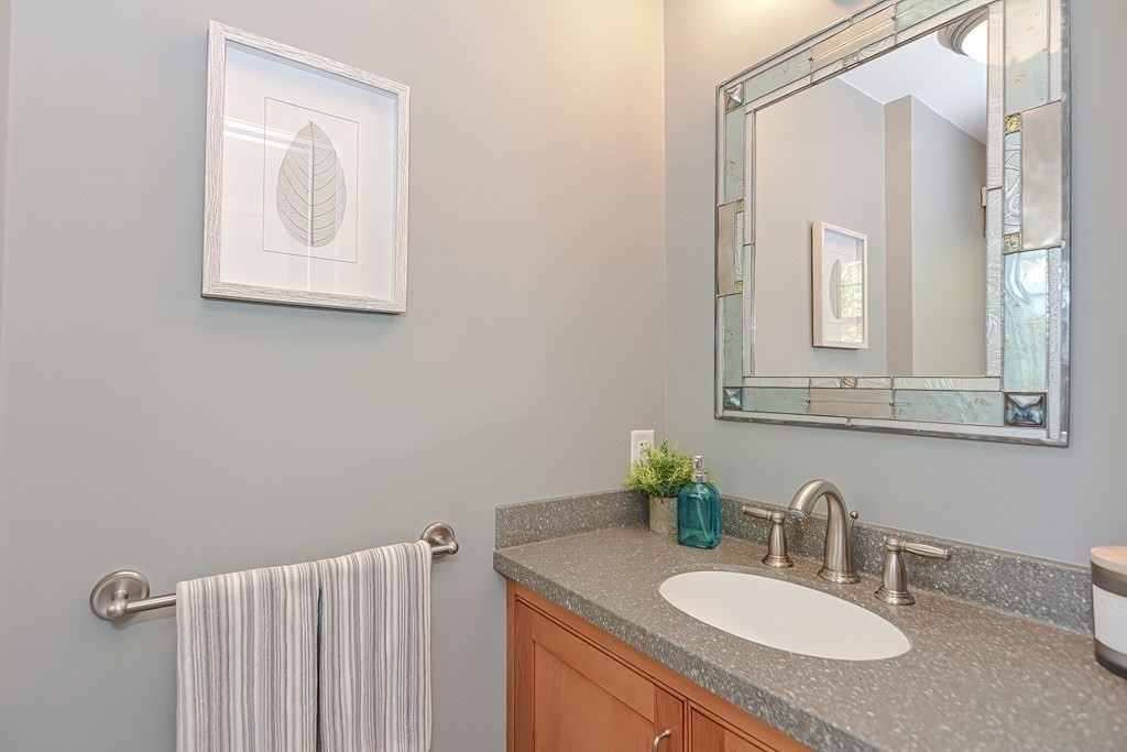 2 Meadowbrook Road Acton, MA 01720 - Photo 17 of 36 a bathroom with a granite countertop sink vanity and mirror