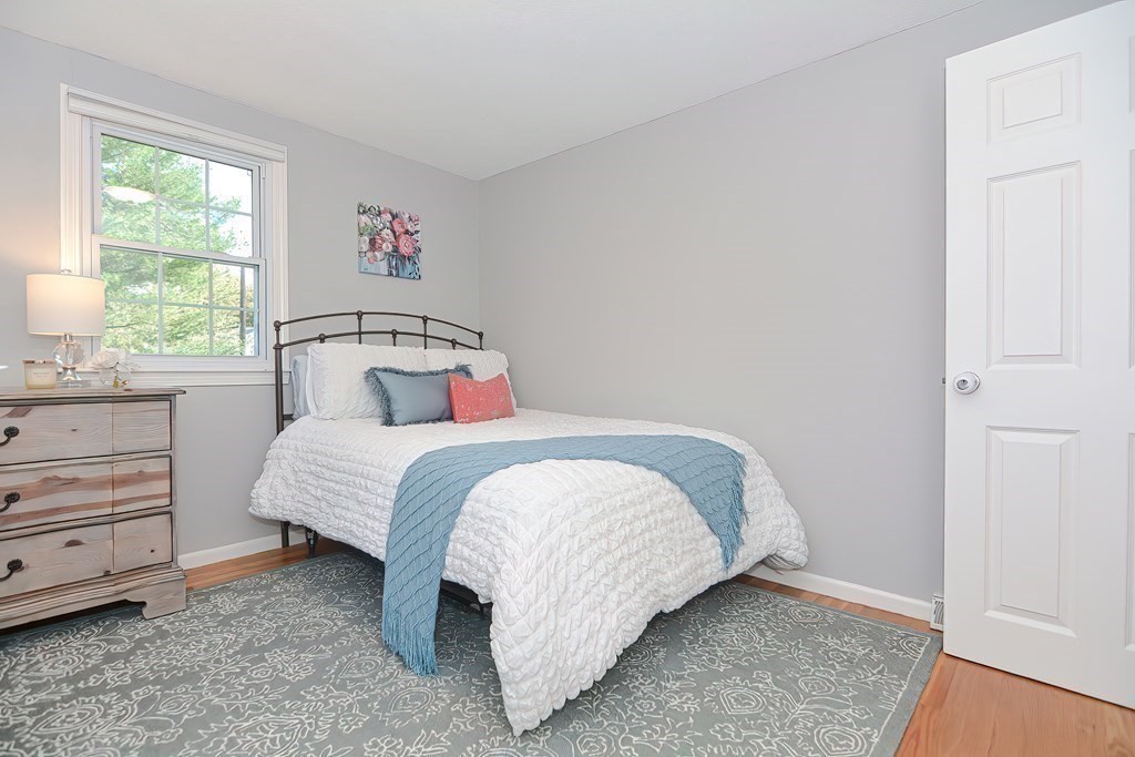 2 Meadowbrook Road Acton, MA 01720 - Photo 23 of 36 a bedroom with a bed and a window