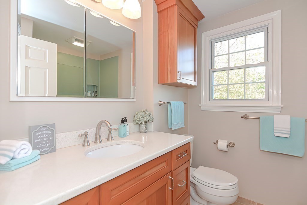 2 Meadowbrook Road Acton, MA 01720 - Photo 27 of 36 a bathroom with a sink toilet vanity and granite
