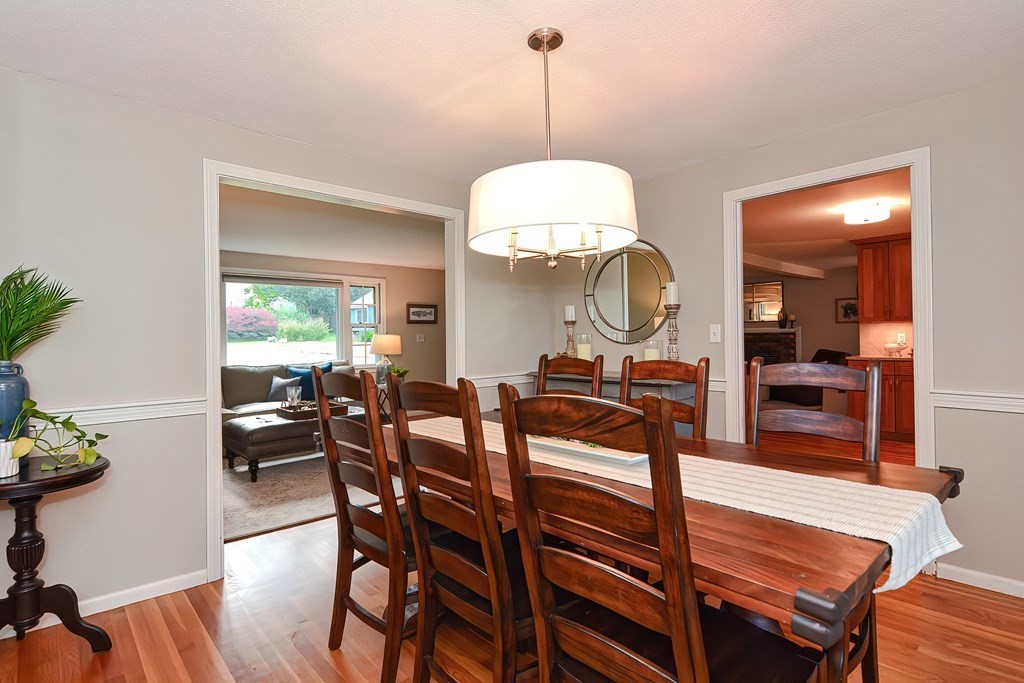 2 Meadowbrook Road Acton, MA 01720 - Photo 3 of 36 a view of a dining room with furniture and wooden floor