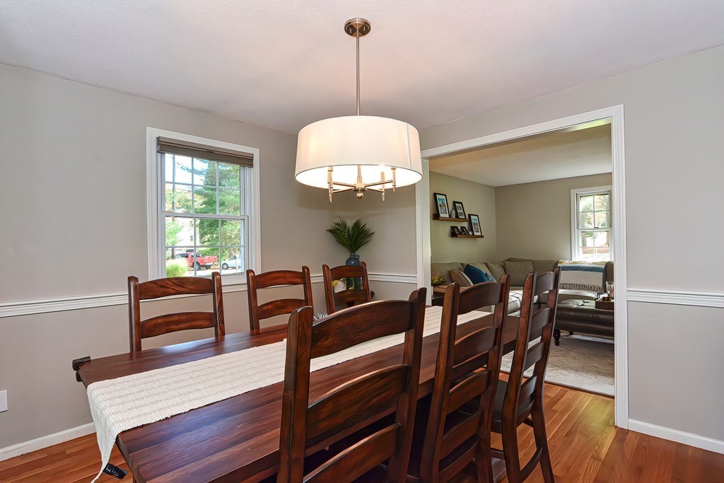 2 Meadowbrook Road Acton, MA 01720 - Photo 4 of 36 a view of a dining room with furniture and chandelier