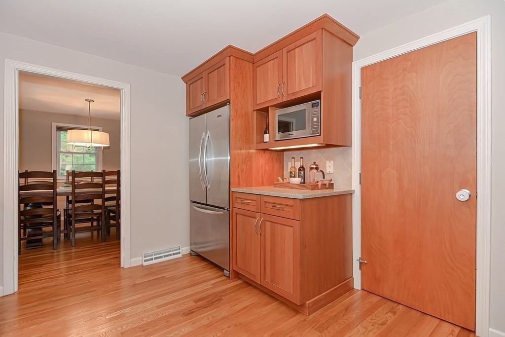 2 Meadowbrook Road Acton, MA 01720 - Photo 9 of 36 a kitchen with stainless steel appliances granite countertop a refrigerator and a stove top oven
