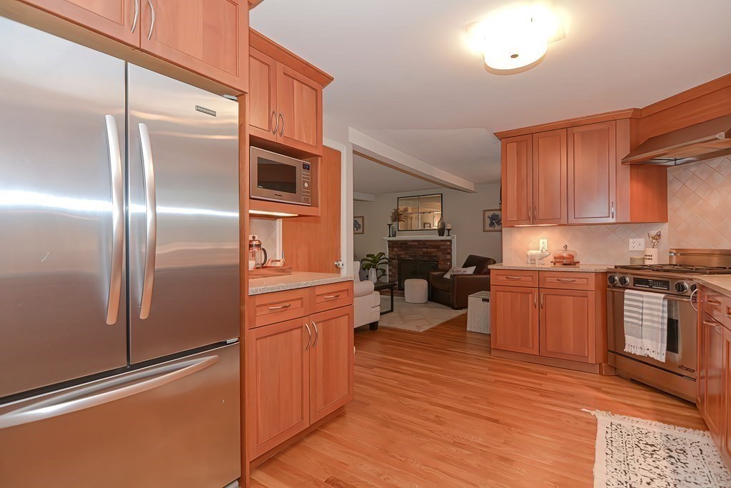 2 Meadowbrook Road Acton, MA 01720 - Photo 10 of 36 a kitchen with stainless steel appliances granite countertop a refrigerator stove and sink