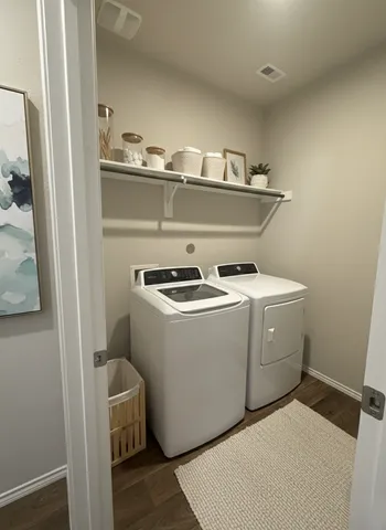a utility room with dryer and washer