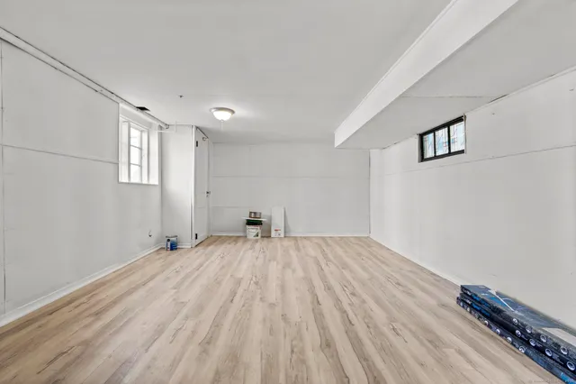 a view of a patio with a table and chairs