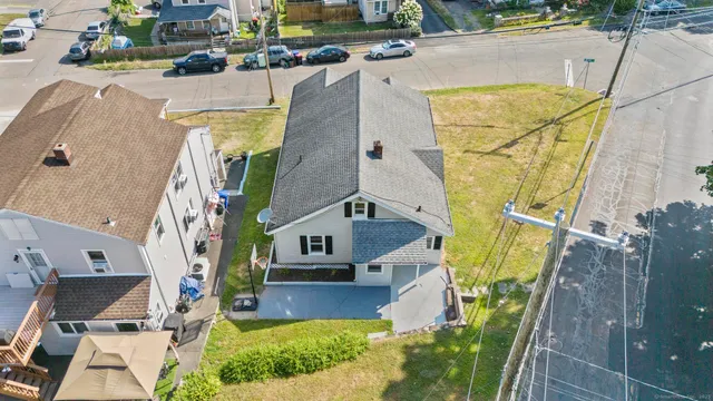 a aerial view of a house with a yard