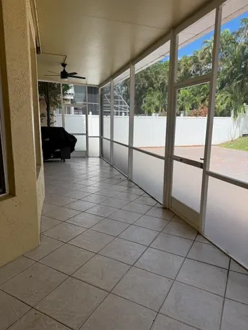 a view of a house with wooden floor and a large window