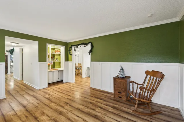 a view of kitchen with furniture and wooden floor