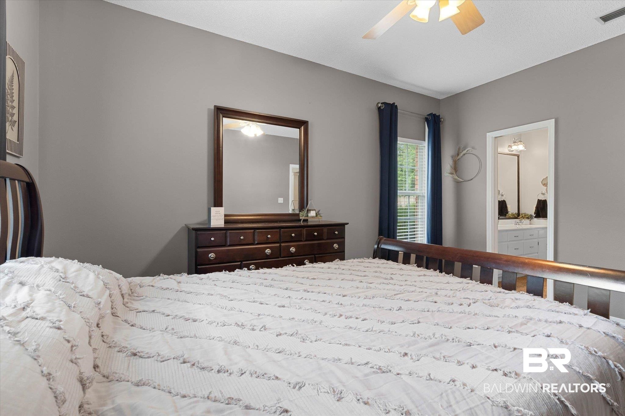 3170 Scott Dairy Loop Road West Mobile, AL 36695 - Photo 12 of 24 Bedroom featuring neutral wall colors, sloped ceiling, and a ceiling fan