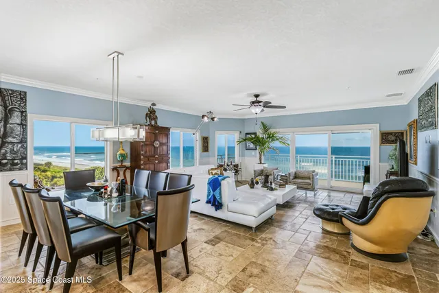 a living room with furniture fireplace and flat screen tv