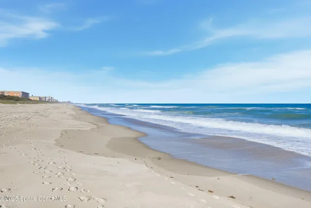 a view of a patio with table and chairs and potted plants