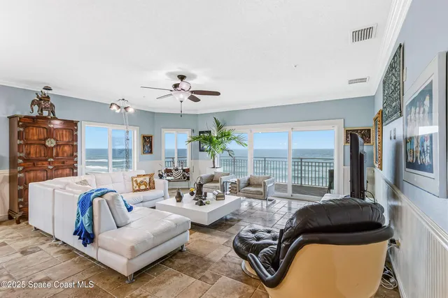 a view of a chairs and table in the balcony