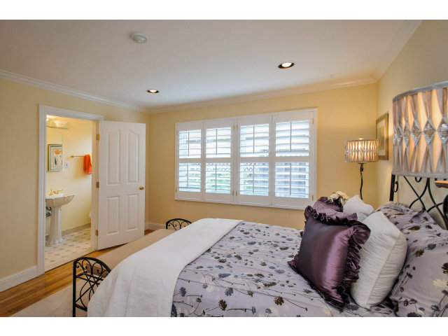 512 Princeton Road San Mateo, CA 94402 - Photo 12 of 13 a bedroom with a bed and wooden floor