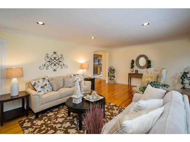 512 Princeton Road San Mateo, CA 94402 - Photo 3 of 13 a living room with furniture a rug and a lamp
