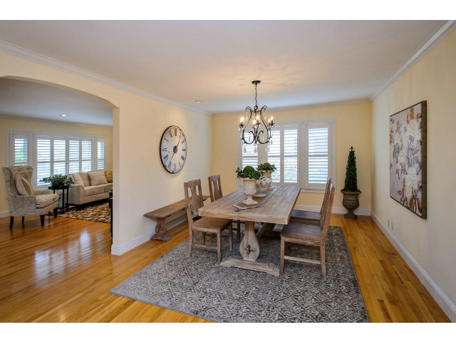 512 Princeton Road San Mateo, CA 94402 - Photo 4 of 13 a view of a dining room with furniture a chandelier and wooden floor