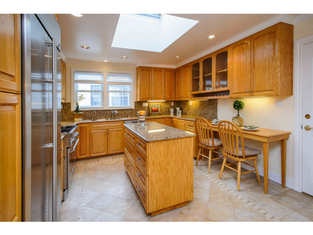512 Princeton Road San Mateo, CA 94402 - Photo 6 of 13 a kitchen with granite countertop a sink stove and cabinets