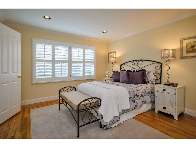 512 Princeton Road San Mateo, CA 94402 - Photo 10 of 13 a bedroom with a bed and a cabinets