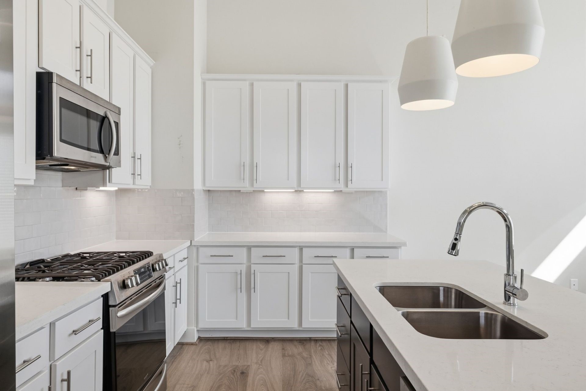 2948 Alice Street Houston, TX 77054 - Photo 11 of 24 a kitchen with stainless steel appliances granite countertop a sink stove and microwave