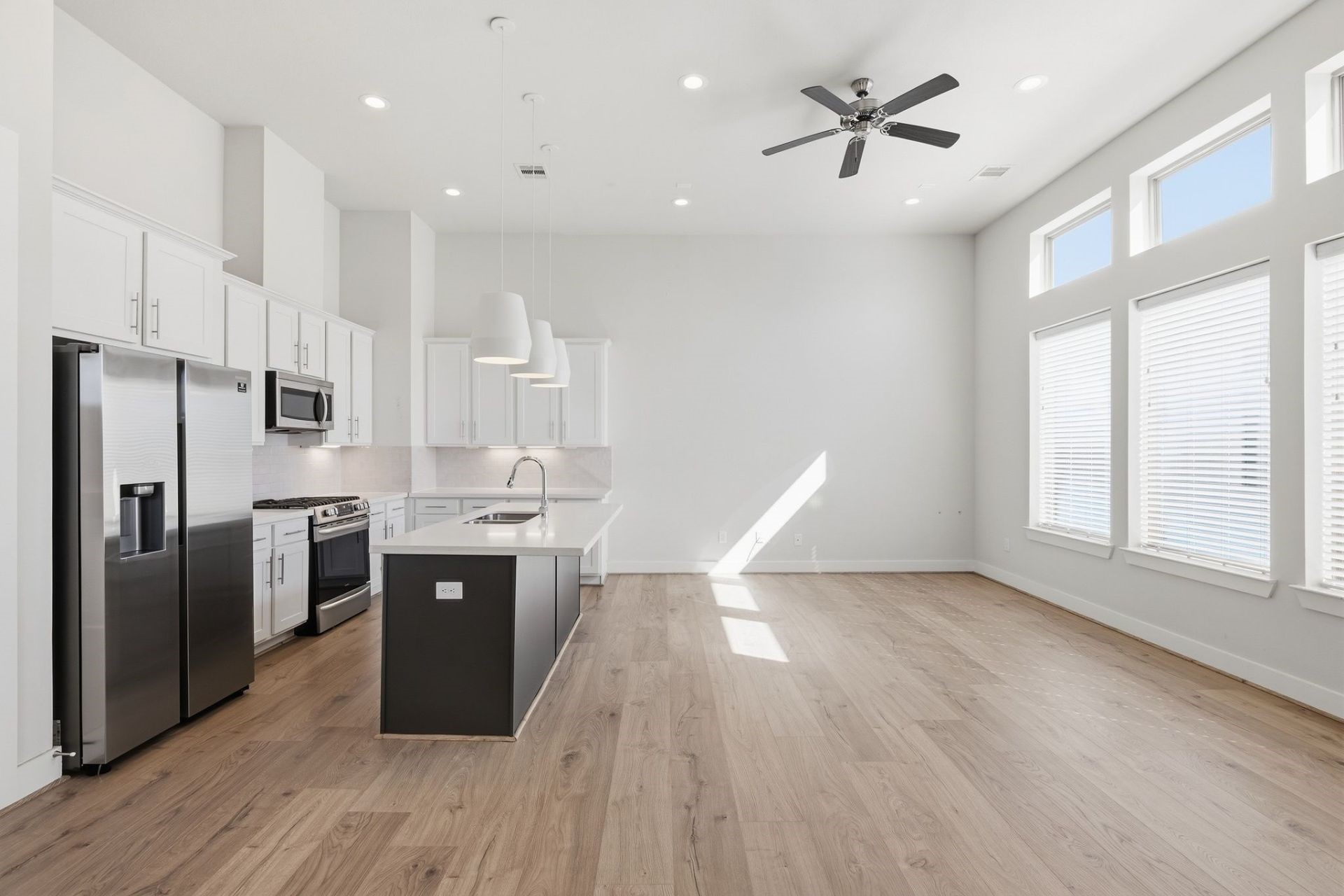 2948 Alice Street Houston, TX 77054 - Photo 6 of 24 a kitchen with stainless steel appliances a refrigerator a sink dishwasher a stove and white countertops with wooden floor