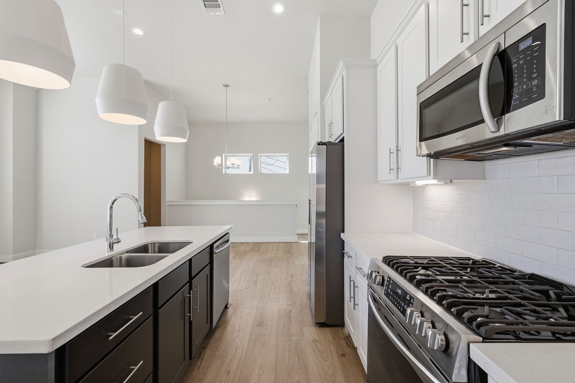 2948 Alice Street Houston, TX 77054 - Photo 10 of 24 a kitchen with stainless steel appliances granite countertop a sink a stove and a refrigerator