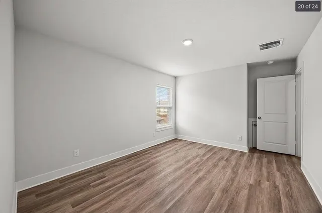 a bathroom with a toilet a sink a mirror a bathtub and shower