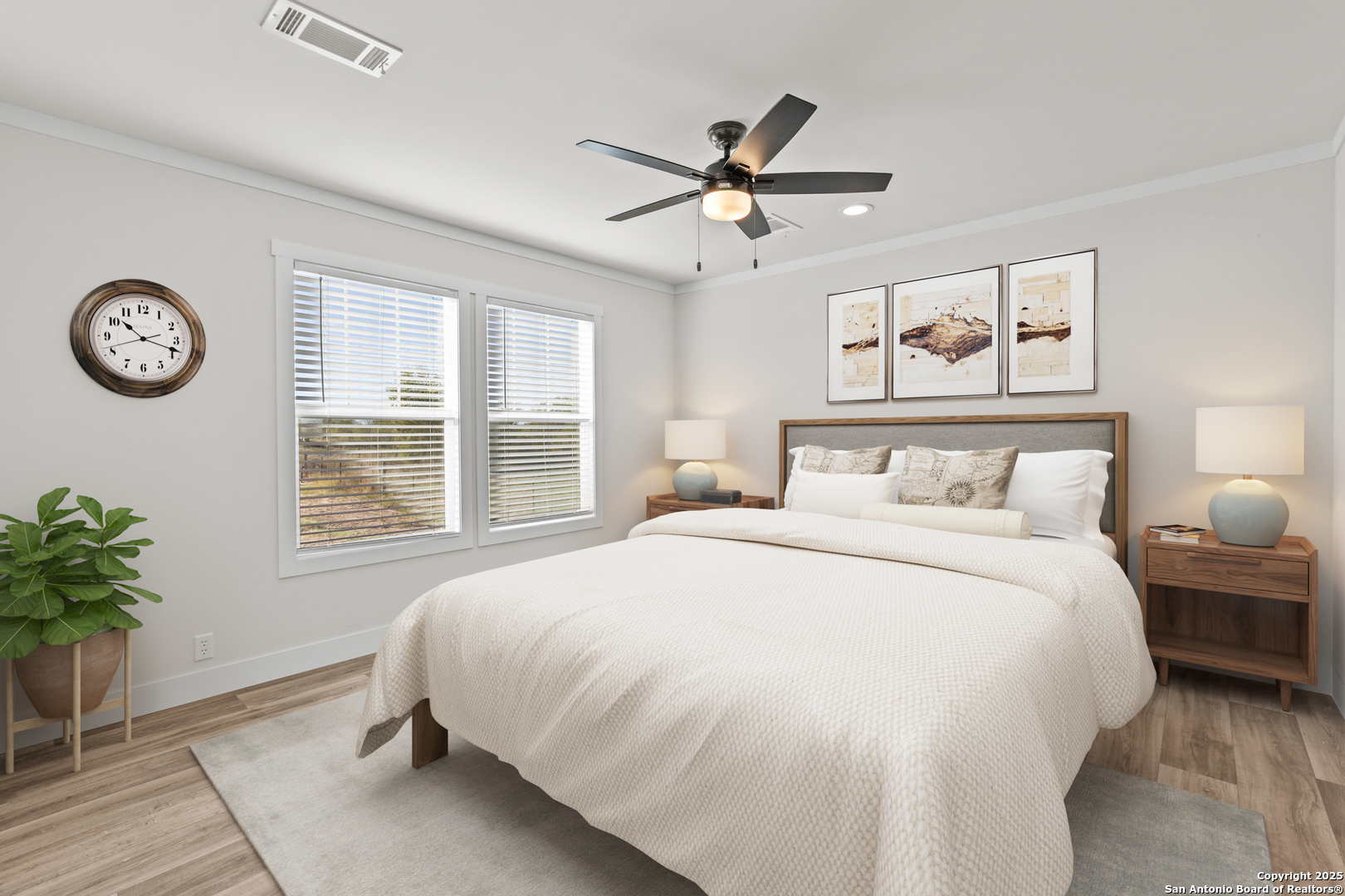 2354 Stevens Road Somerset, TX 78069 - Photo 14 of 22 a bedroom with a large bed and a chandelier