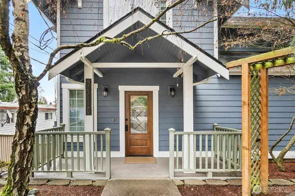 a view of a house with a small deck