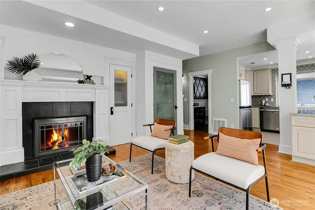 a living room with furniture and a fireplace