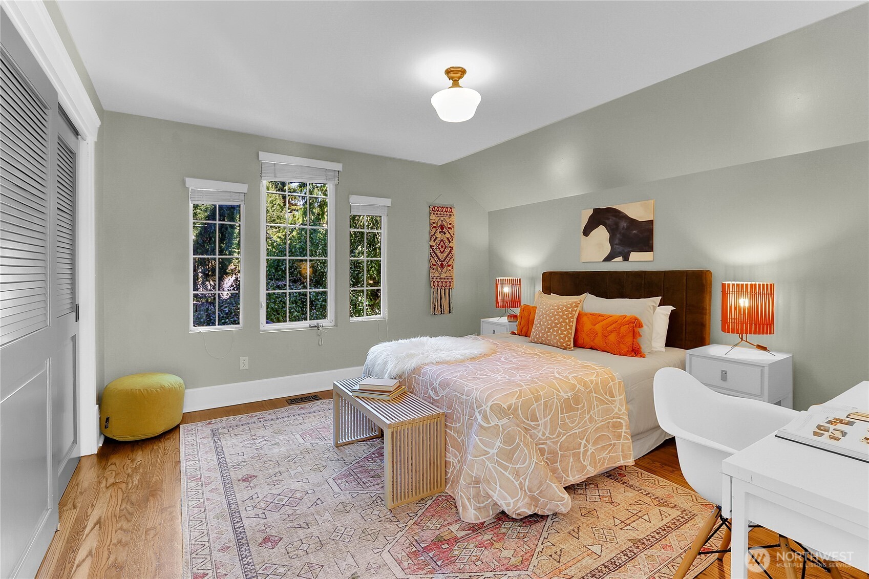 9510 9th Avenue Northwest Seattle, WA 98117 - Photo 22 of 31 a bedroom with a bed and wooden floor