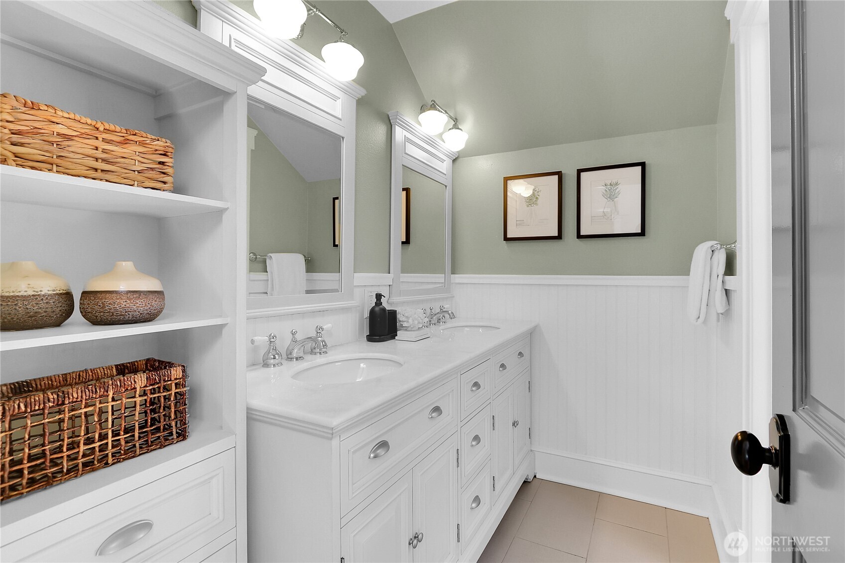 9510 9th Avenue Northwest Seattle, WA 98117 - Photo 23 of 31 a bathroom with a double vanity sink and a mirror