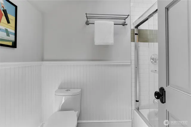 a bathroom with a shower and toilet
