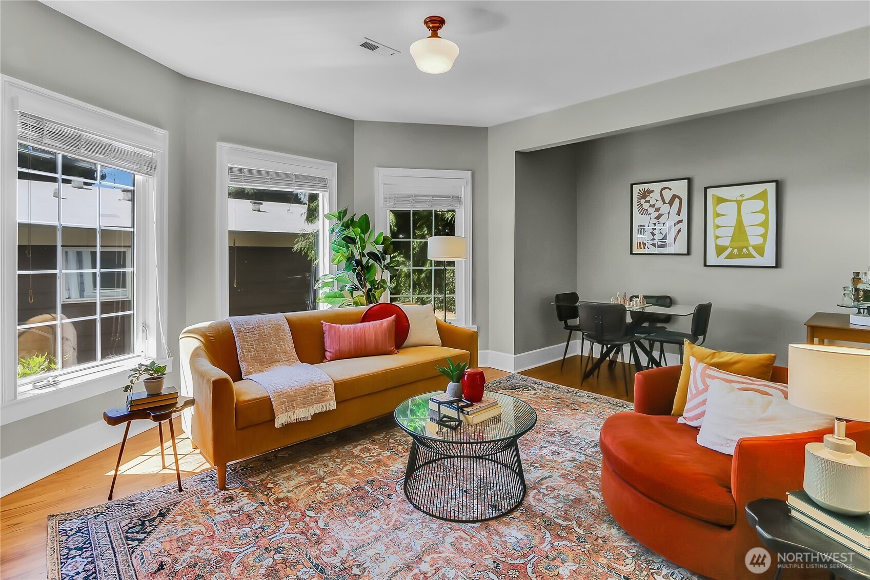 9510 9th Avenue Northwest Seattle, WA 98117 - Photo 4 of 31 a living room with furniture and a potted plant