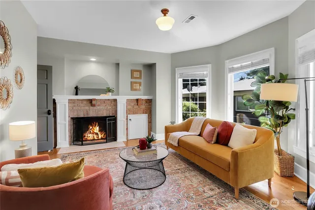 a living room with furniture and a fireplace