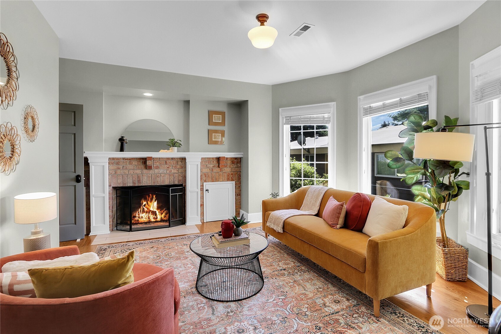 9510 9th Avenue Northwest Seattle, WA 98117 - Photo 5 of 31 a living room with furniture and a fireplace