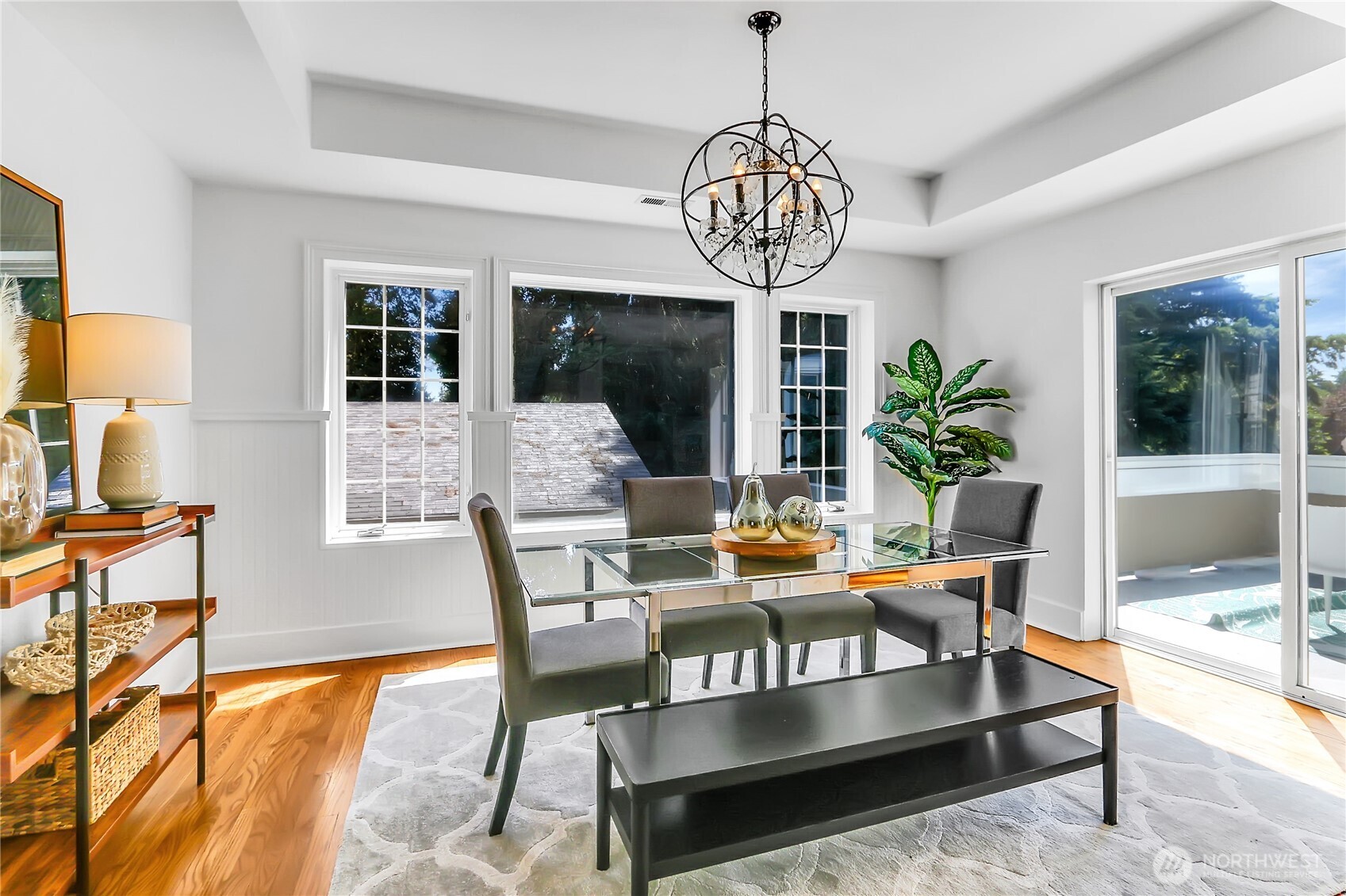 9510 9th Avenue Northwest Seattle, WA 98117 - Photo 7 of 31 a view of a dining room with furniture wooden floor and chandelier
