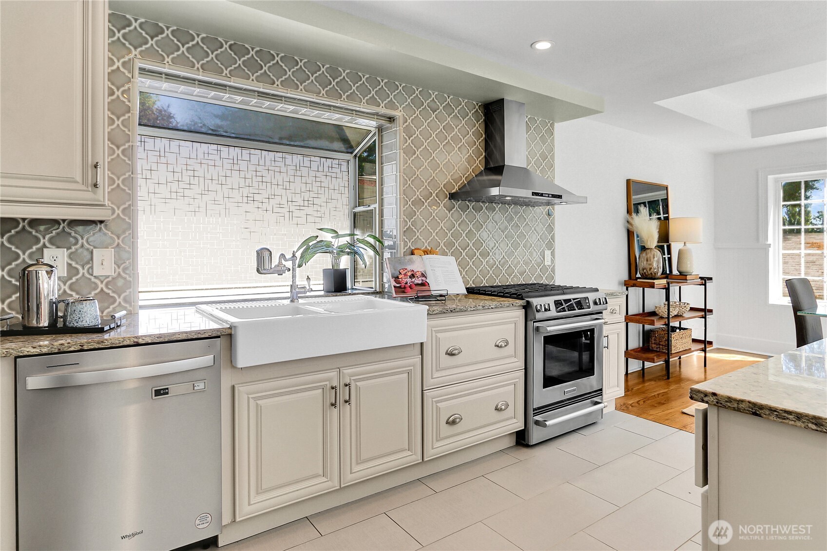 9510 9th Avenue Northwest Seattle, WA 98117 - Photo 8 of 31 a kitchen with white cabinets and appliances