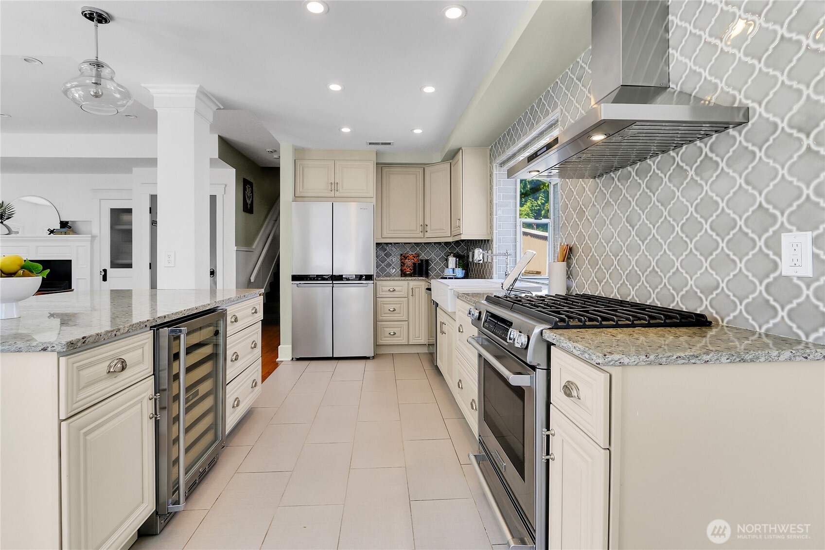 9510 9th Avenue Northwest Seattle, WA 98117 - Photo 9 of 31 a kitchen with stainless steel appliances granite countertop a stove and a refrigerator