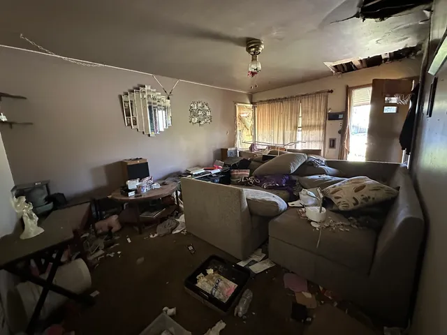 a living room with furniture and a window
