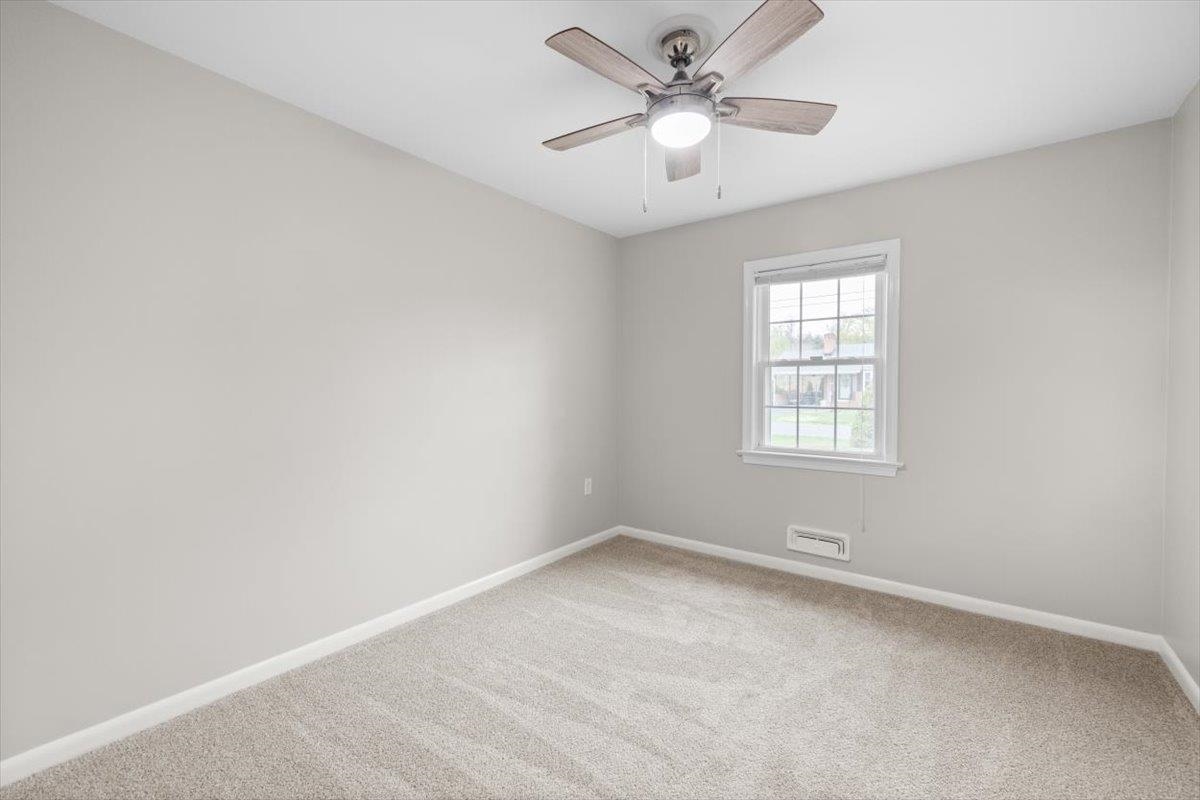 13 Springcrest Drive Luray, VA 22835 - Photo 15 of 41 an empty room with a window and a fan