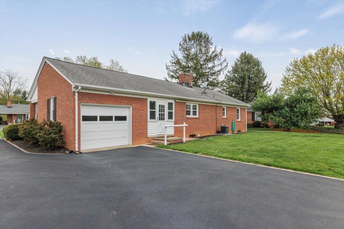 13 Springcrest Drive Luray, VA 22835 - Photo 2 of 41 a view of a house with a yard and potted plants