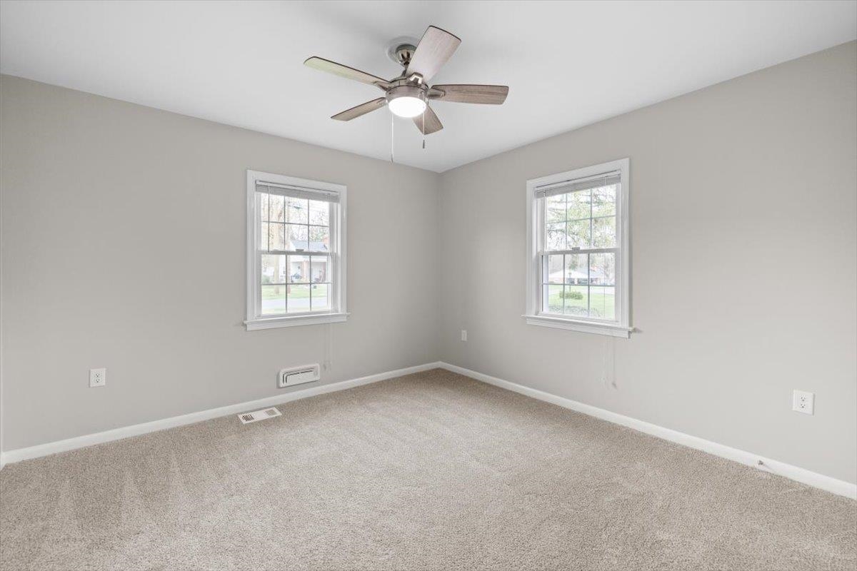 13 Springcrest Drive Luray, VA 22835 - Photo 27 of 41 an empty room with windows and ceiling fan