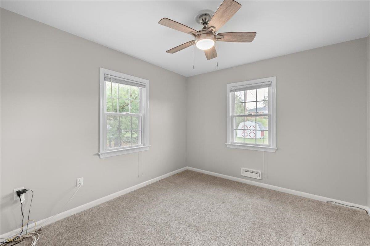 13 Springcrest Drive Luray, VA 22835 - Photo 31 of 41 an empty room with a window and a fan
