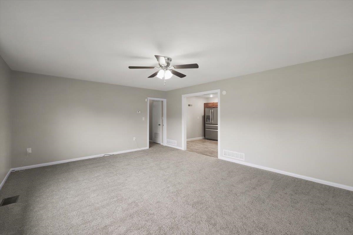 13 Springcrest Drive Luray, VA 22835 - Photo 6 of 41 a view of an empty room with a ceiling fan