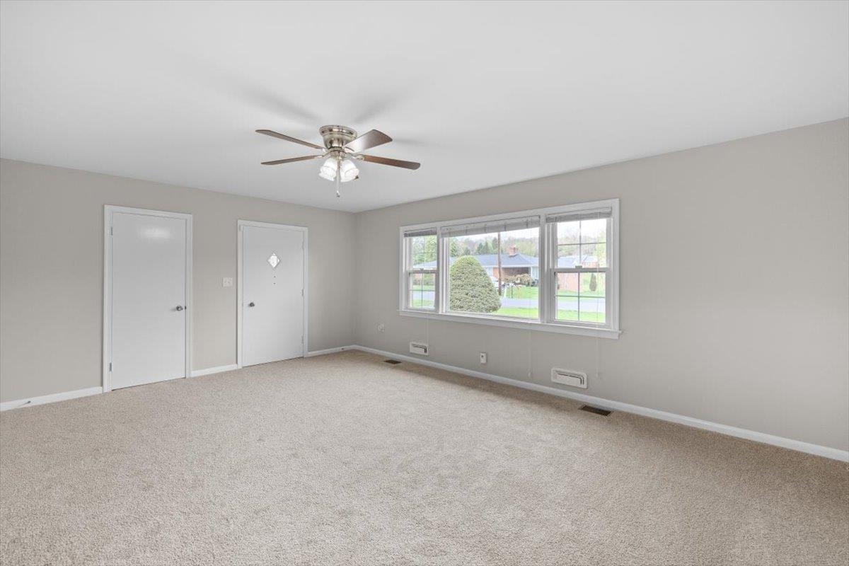 13 Springcrest Drive Luray, VA 22835 - Photo 8 of 41 an empty room with a window and a fan
