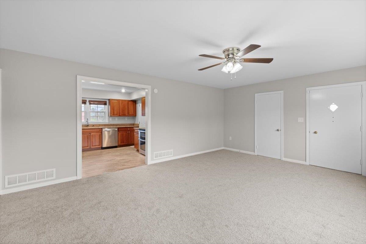 13 Springcrest Drive Luray, VA 22835 - Photo 9 of 41 a view of a big room with a ceiling fan and a window