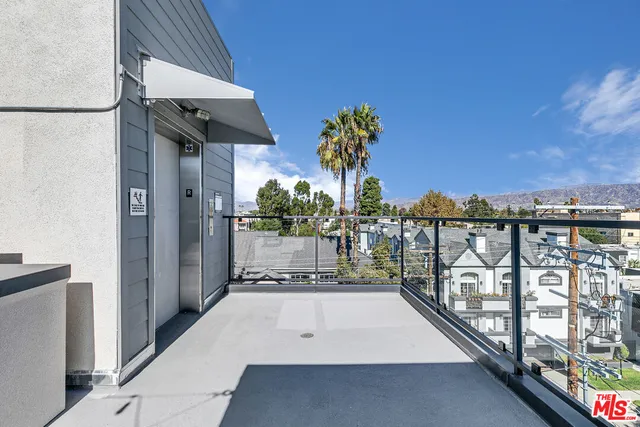 a view of a balcony with city view