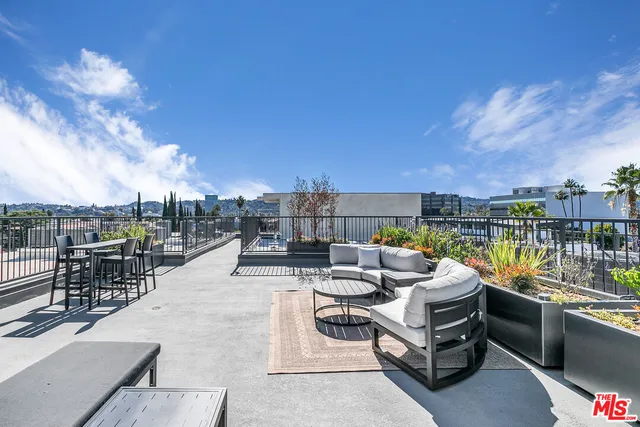 a view of roof deck with patio