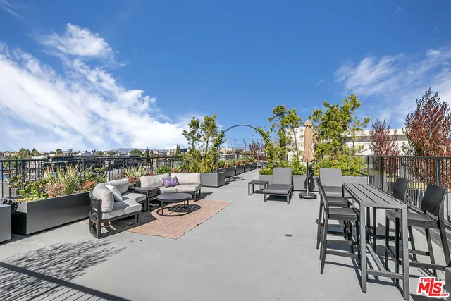 a view of a terrace with furniture