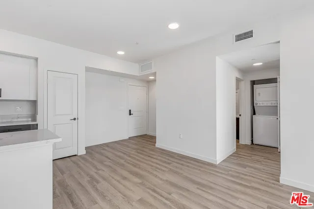 a view of hallway with wooden floor